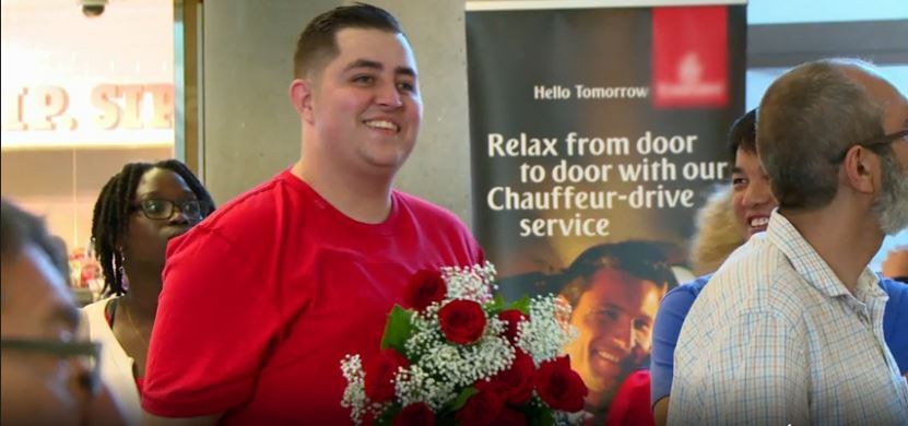 Jorge-Red-Shirt-Holding-Flowers-90-Day-Fiance