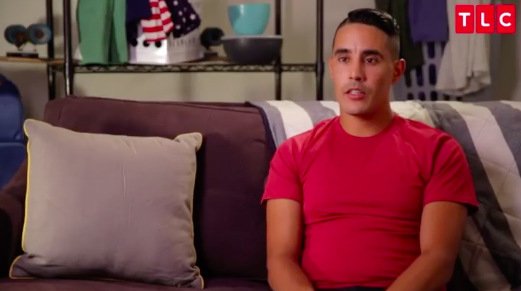 Mohamed-Red-Shirt-Couch-90-Day-Fiance