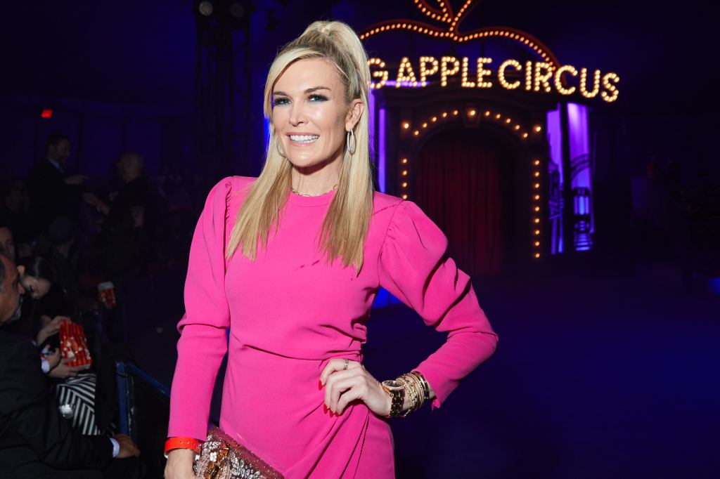 Tinsley Mortimer with her hand on her hip and wearing a pink dress at the Big Apple Circus