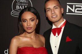 Serene Russell wearing a red dress and posing with Brandon Jones, who is wearing a black tuxedo with red accessories.