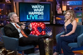 On Watch What Happens live, Andy Cohen is sitting on the left wearing a suit and laughing while Ramona Singer sits on the right in a blue outfit.