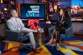 Still from Watch What Happens Live where Andy Cohen is in a grey suit and sitting with Bethenny Frankel, who is wearing a black suit.