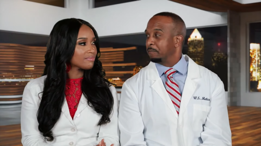 Dr. Contessa and Dr. Scott Metcalfe in a joint confessional on Married to Medicine wearing their doctor's coats