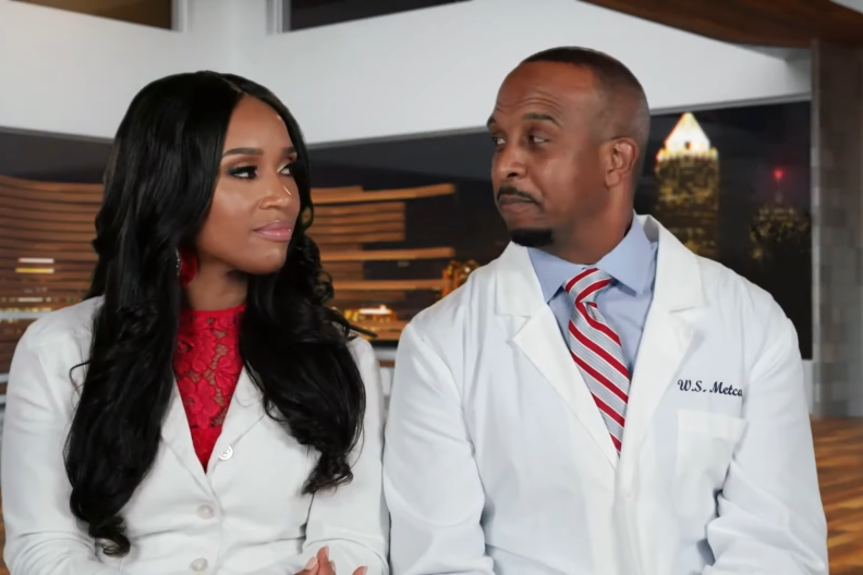 Dr. Contessa and Dr. Scott Metcalfe in a joint confessional on Married to Medicine wearing their doctor's coats