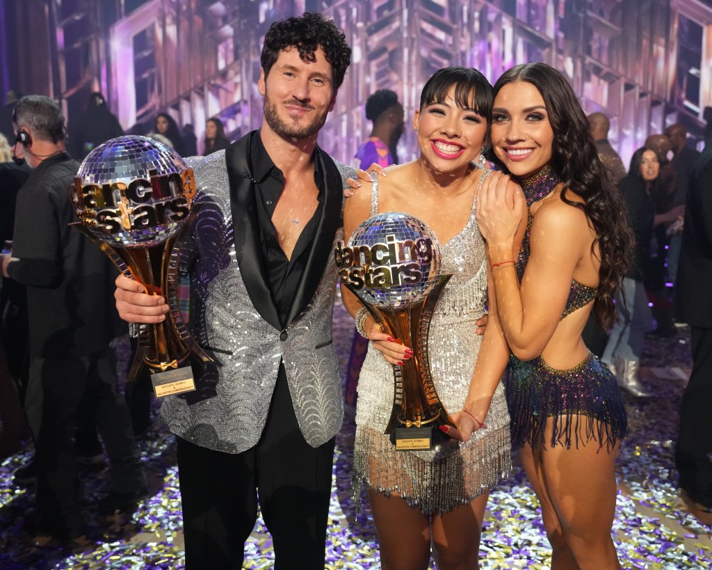 Val Chmerkovskiy, Xochitl Gomez, and Jenna Johnson at the Dancing with the Stars Season 32 finale. Val and Xochitl are holding their trophies.
