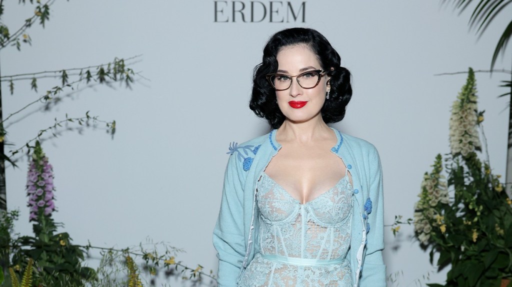 Dita Von Teese in a light blue lace outfit.