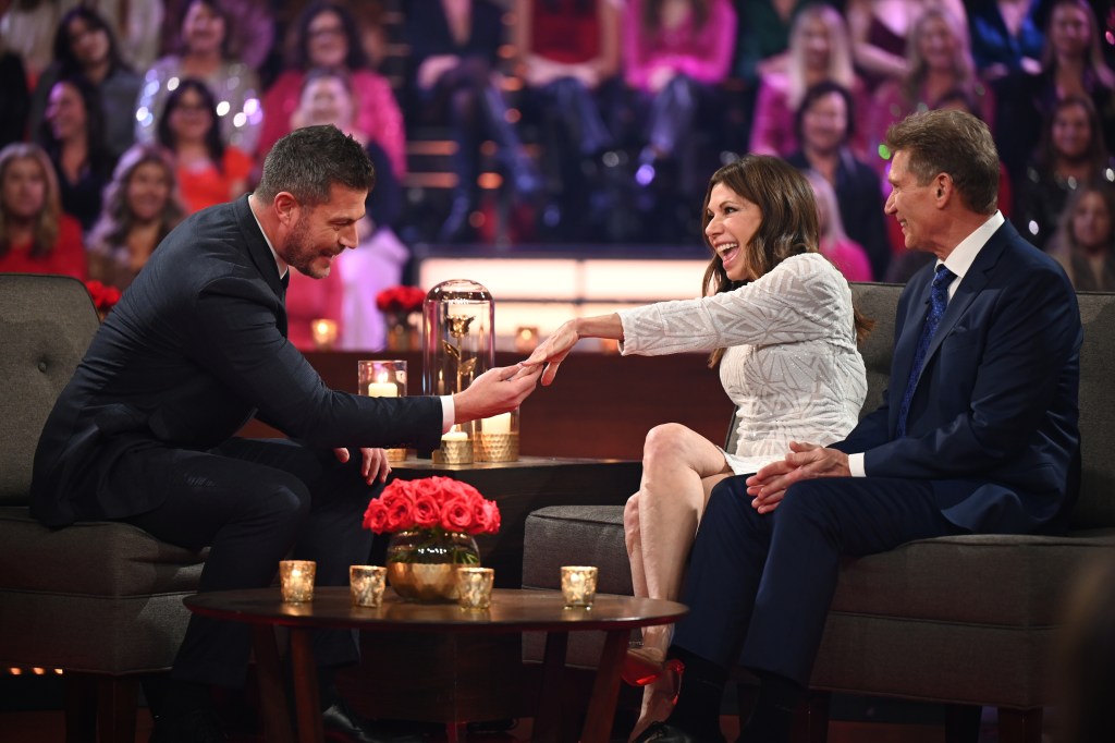 Theresa Nist and Gerry Turner on the Golden Bacehlor; Theresa is showing her ring to host Jesse Palmer.