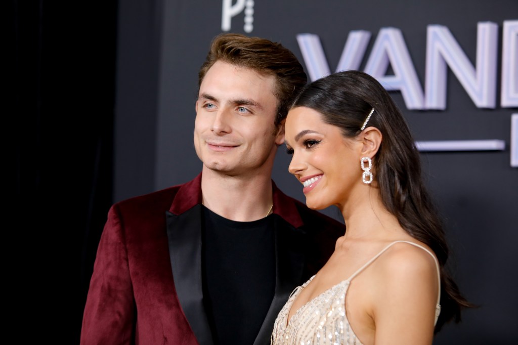 James Kennedy and Ally Lewber at the Vanderpump Rules Season 11 premiere; James is wearing a red suit and Ally is wearing a golden gown