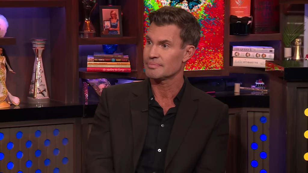 Jeff Lewis on Watch What Happens Live; he's wearing a suit and making a serious face.