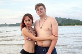 Brandan and Mary Denucciõ on a beach, Brandan is shirtless and Mary is in a bathing suit with her arms around him