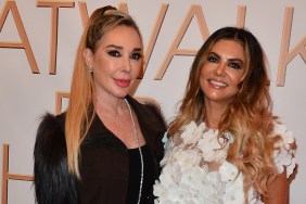 Adriana de Moura in a white top standing and smiling with Marysol Patton, who is wearing black