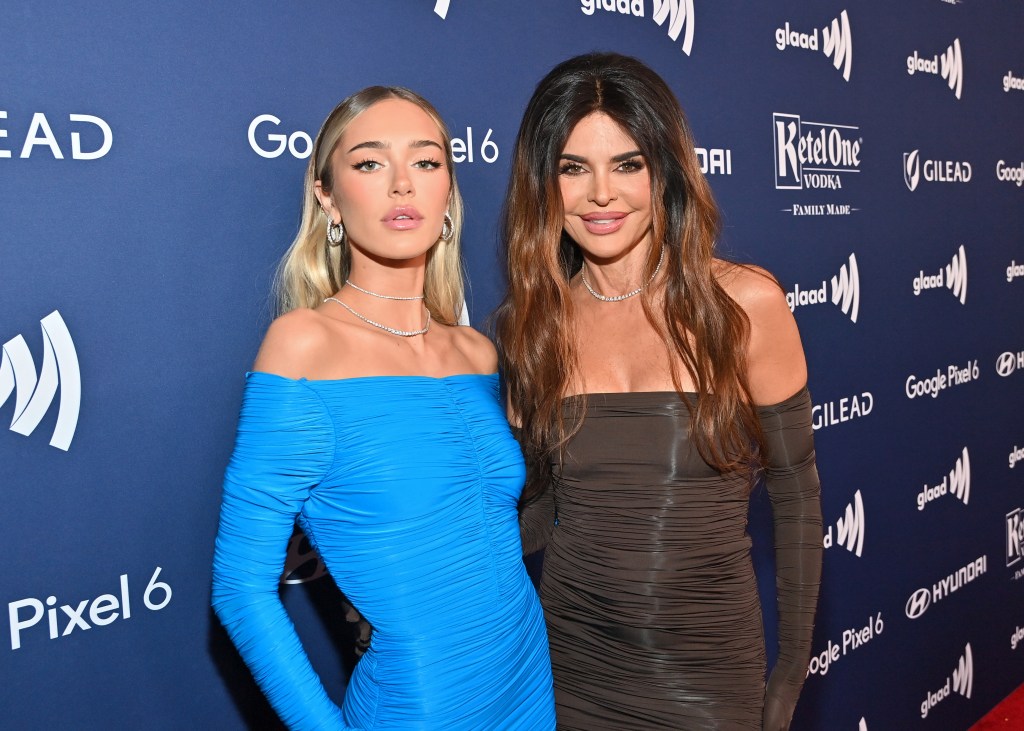 Delilah Hamlin and Lisa Rinna at a red carpet event; Delilah is wearing a blue dress and Rinna is wearing grey.