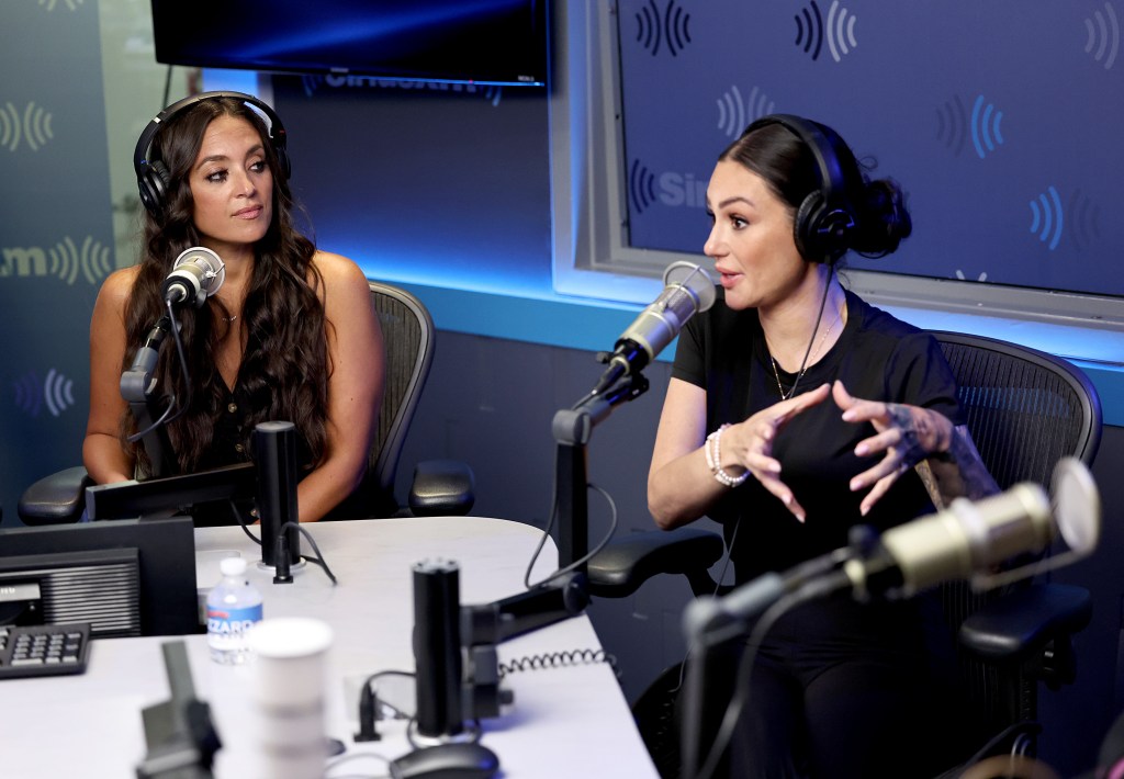 Jenni "Jwoww" Farley and Sammi Giancola in a Sirius XM studio; they're both waring black tops and black headphones