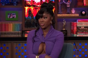 Dr. Wendy Osefo on watch What Happens Live wearing a purple dress and looking to the side