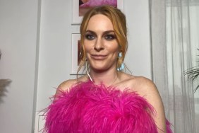 Leah McSweeney smiling and a wearing a pink top with feathers on Watch What Happens Live