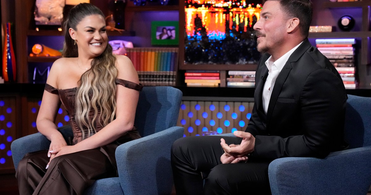 Brittany Cartwright and Jax Taylor looking at each other during an episode of Watch What Happens Live