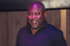 Simon Guobadia smiling and wearing in a navy blue shirt