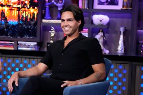 Ben Willoughby smiling and wearing an all-black outfit sitting on a chair during an appearance on Watch What Happens Live