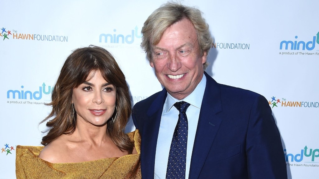 Nigel Lythgoe and Paula Abdul posing together at a red carpet event