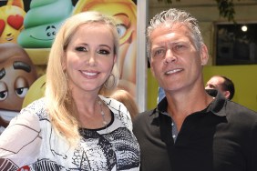 Shannon Beador in a white top posing with David Beador, who is wearing a black shirt with a collar