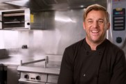 Chef Nick Tatlock smiling in a confessional interview on Below Deck Season 11