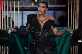 Porsha Williams in a black dress making a shocked expression while sitting on a green chair during the Real Housewives of Atlanta Season 13 reunion