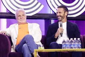 Captain Lee Rosbach sitting with his legs crossed next to Captain Jason Chambers, who is holding a microphone