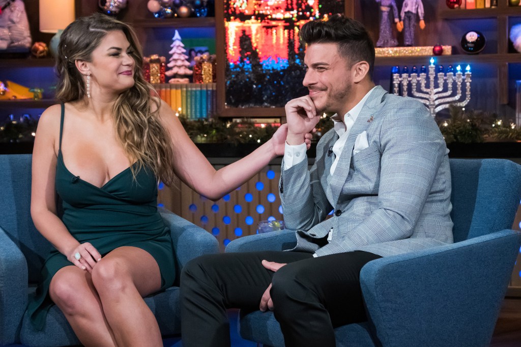Brittany Cartwright and Jax Taylor on Watch What Happens Live; Brittany has her hand on Jax's shoulder