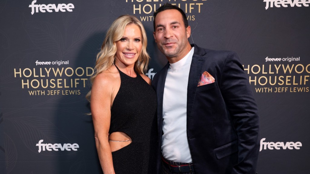 Jennifer Pedranti and Ryan Boyajian posing together, smiling, and wearing black