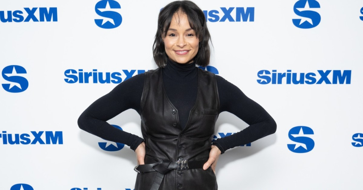 Sai De Silva at Sirius XM Studios standing with her hands on her hips in an all-black outfit