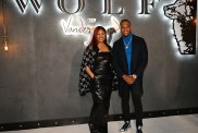 Garcelle Beauvais and Oliver Saunders standing together at Wolf by Vanderpump