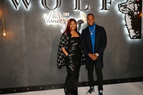 Garcelle Beauvais and Oliver Saunders standing together at Wolf by Vanderpump