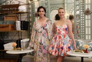 Katie Maloney And Ariana Madix posing inside of Something About Her wearing floral dresses