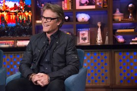 Harry Hamlin on Watch What Happens Live wearing a black suit with his hands folded in his lap