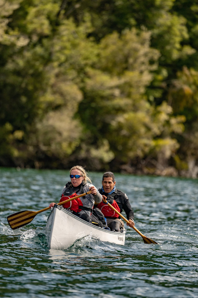 Emilio Navarro and Heather Sishco paddling in a canoe on Race to Survive: New Zealand 