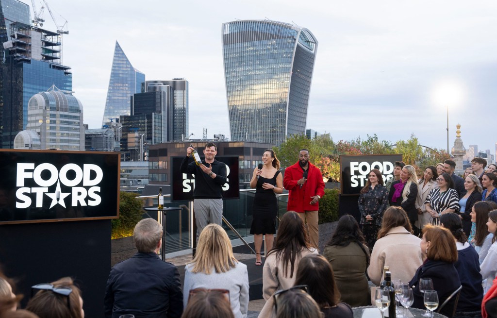 Chuan Liu and cast of Gordon Ramsay's Food Stars at an outside event in England.