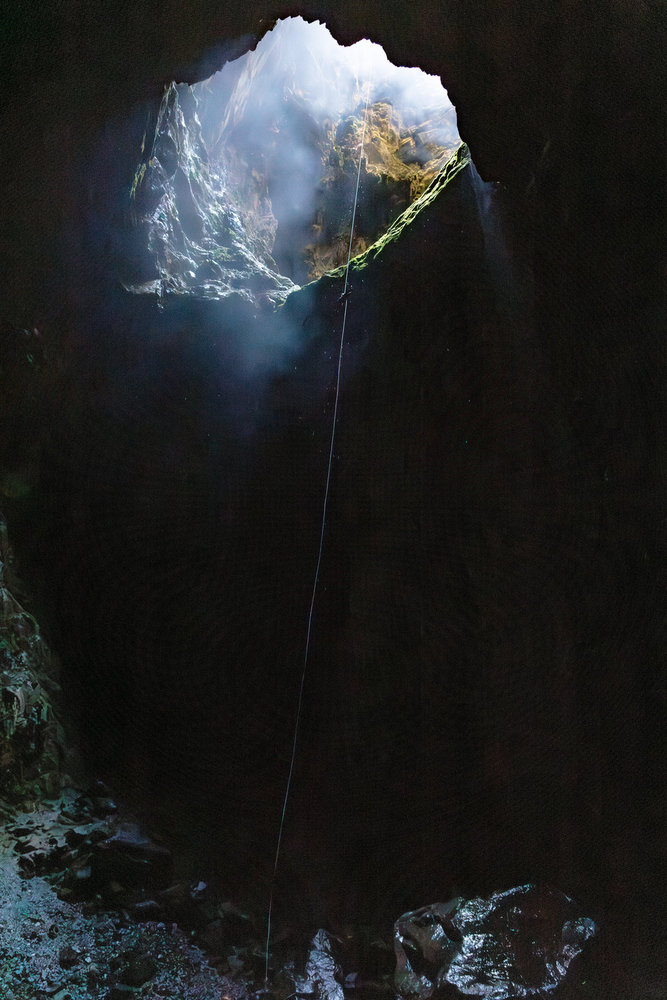 A shot of a cave entrance on Race to Survive: New Zealand