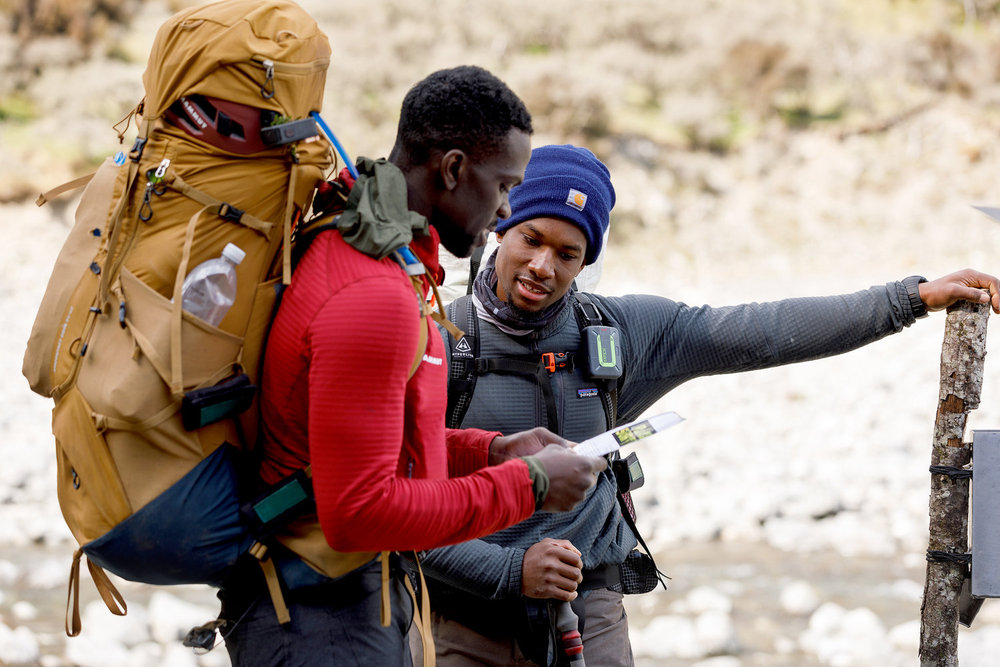 Steffen Jean-Pierre and Mikhail Marti on Race to Survive: New Zealand looking at a map 