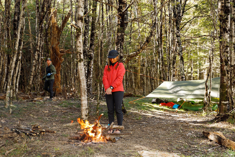 Paulina Pena standing in front of a fire on Race to Survive: New Zealand