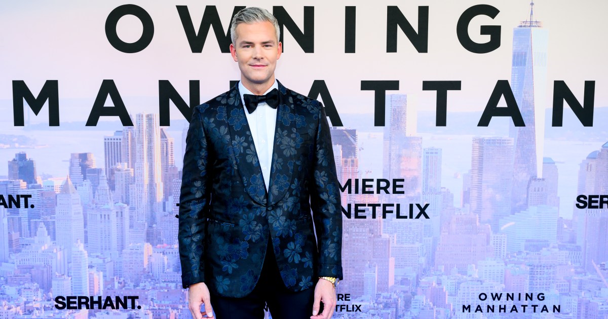 Ryan Serhant in a blue suit at the premiere of Owning Manhattan