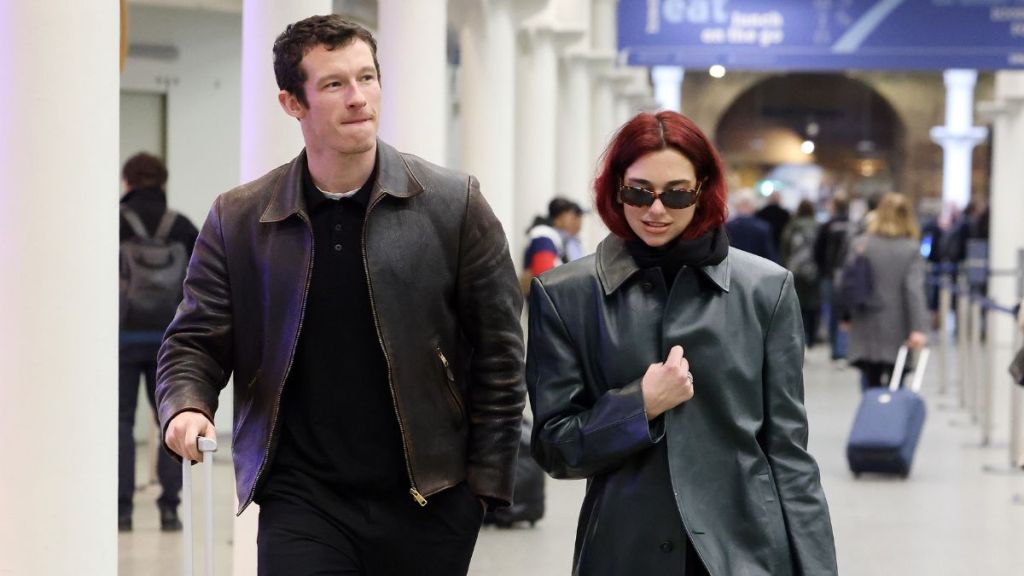 Dua Lipa and Callum Turner arriving at London St Pancras Station after taking the Eurostar from Paris on March 26, 2024 in London, England.