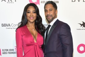 Kenya Moore and Marc Daly posing on a red carpet