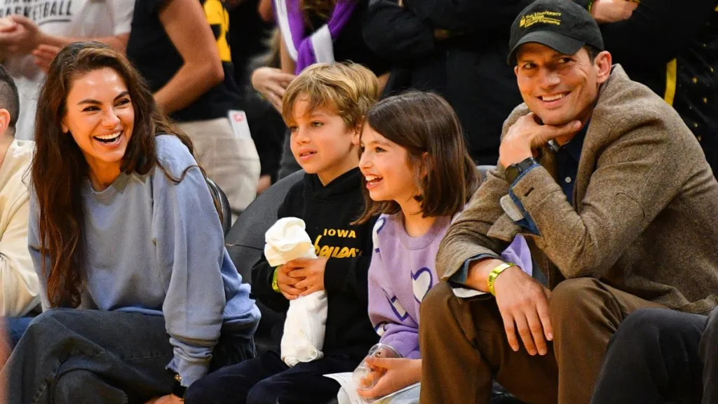 Actors Mila Kunis and Ashton Kutcher and their children look on during the WNBA basketball game between the Indiana Fever and the Los Angeles Sparks on May 24, 2024, at Crypto.com Arena in Los Angeles, CA.