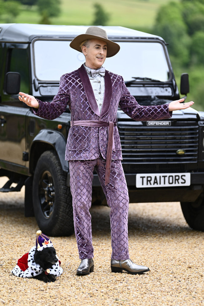 Alan Cumming in a purple suit on a The Traitors Season 3