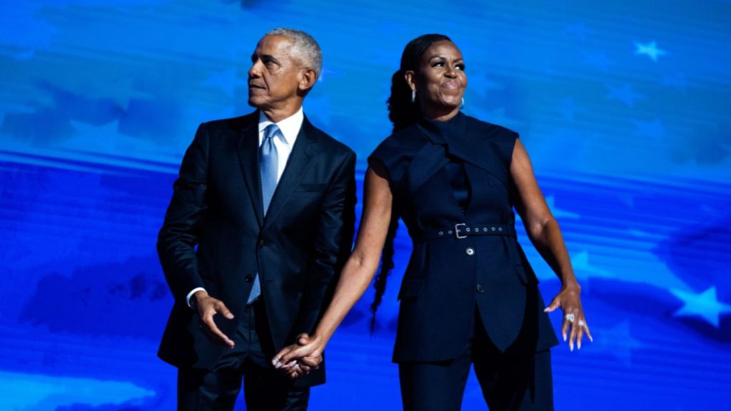Former President Barack Obama and former first lady Michelle Obama appear on stage on the second night of the Democratic National Convention at the United Center in Chicago, Ill., on Tuesday, August 20, 2024.