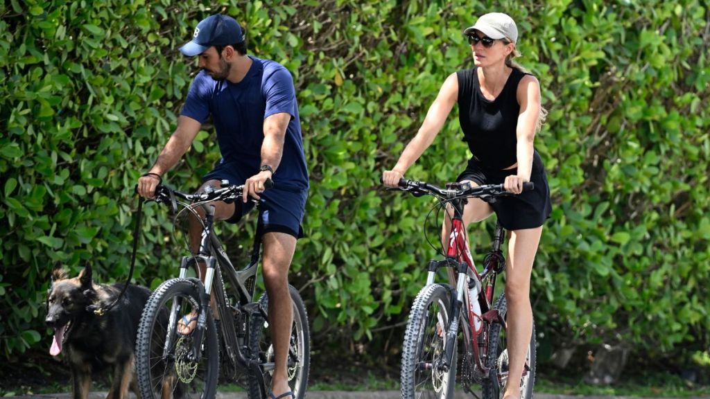 Joaquim Valente and Gisele Bündchen are seen on a bike ride on July 14, 2024 in Surfside, Florida.