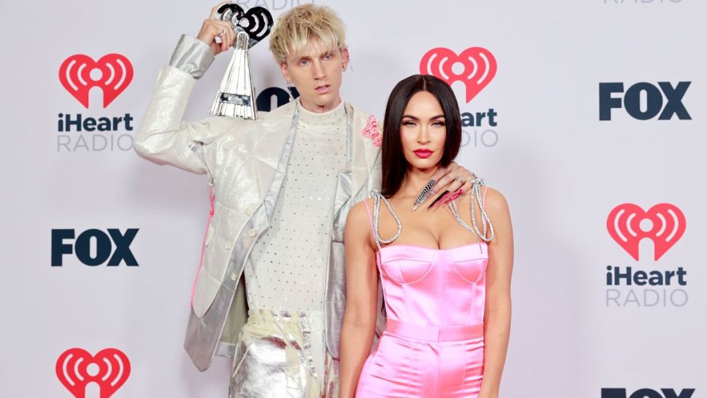 Machine Gun Kelly, winner of the Alternative Rock Album of the Year award for 'Tickets To My Downfall,’ and Megan Fox attend the 2021 iHeartRadio Music Awards at The Dolby Theatre in Los Angeles, California, which was broadcast live on FOX on May 27, 2021.