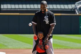 Kanye West and his son Saint throw out a ceremonial first pitch before the game between the Chicago White Sox and the Chicago Cubs on September 23, 2018 at Guaranteed Rate Field in Chicago, Illinois.