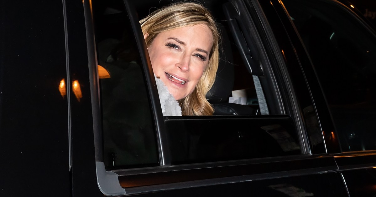 Sonja Morgan sticking her head out the window of a car