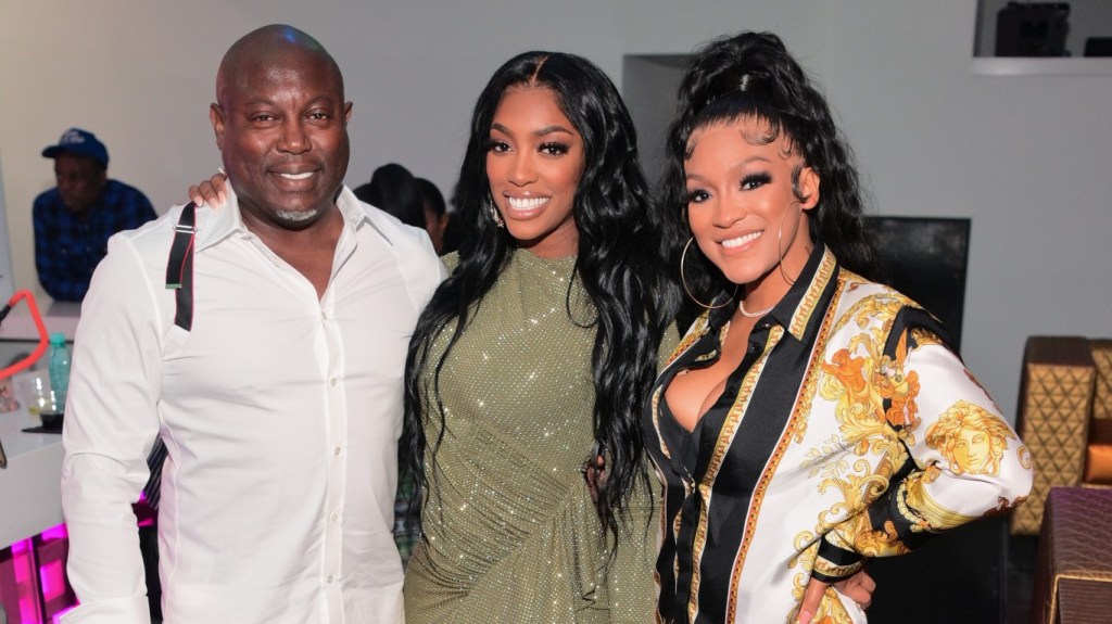 Simon Guobadia, Porsha Williams, and Drew Sidora at a party